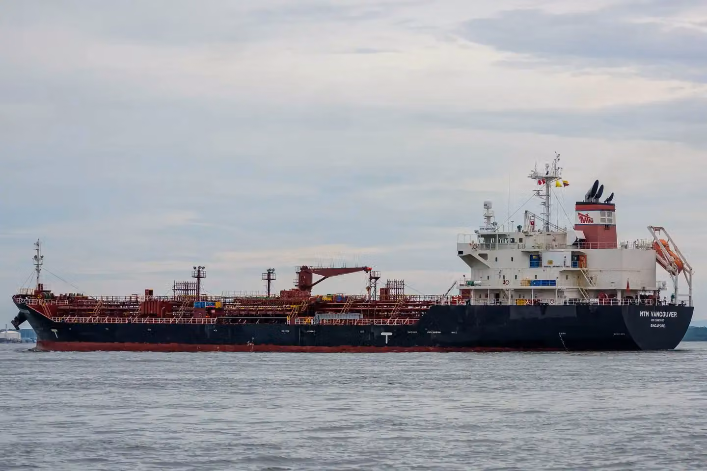 An oil tanker sailing on the open sea, ideal for maritime and logistics concepts.